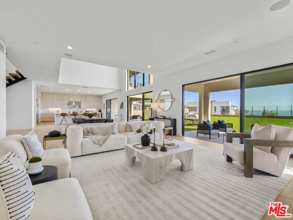 20416 Albion Way Porter Ranch, CA 91326 - Photo 11 of 38 a living room with furniture and large windows