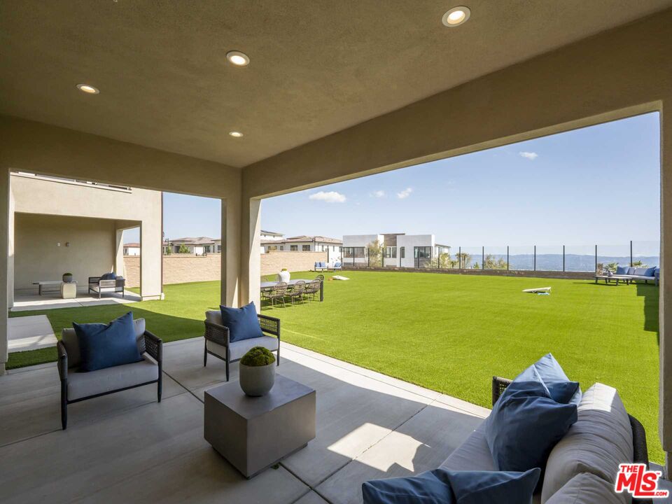 20416 Albion Way Porter Ranch, CA 91326 - Photo 12 of 38 a living room with furniture and garden view