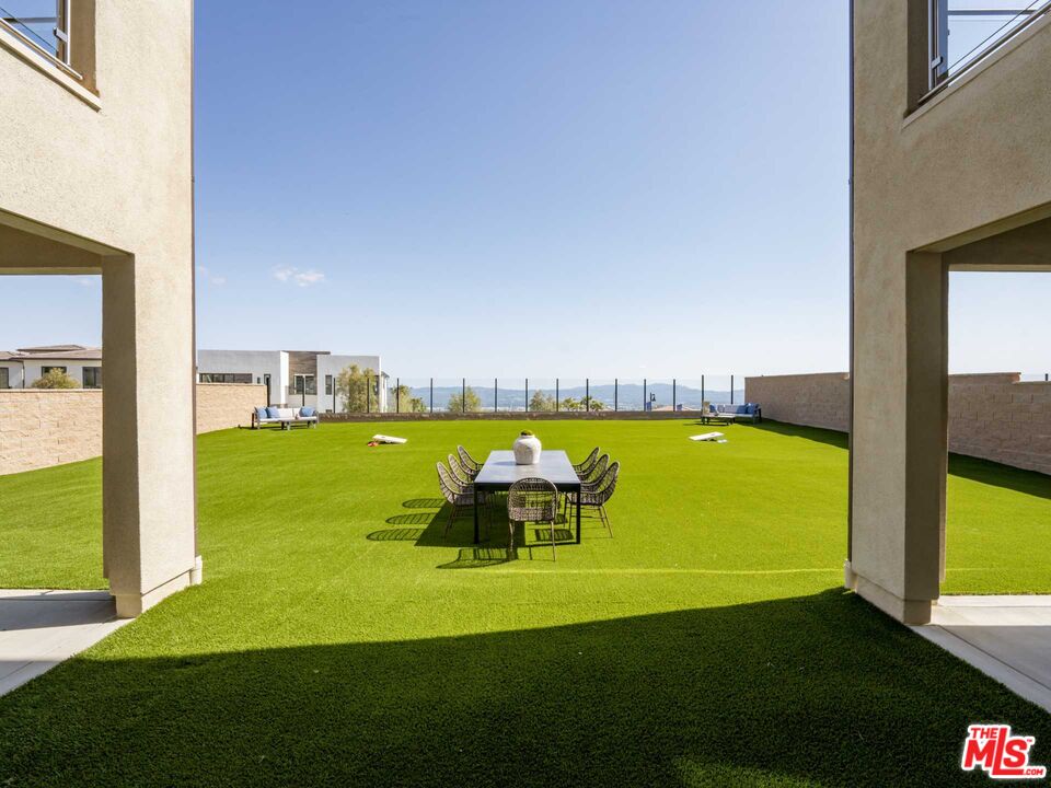 20416 Albion Way Porter Ranch, CA 91326 - Photo 13 of 38 a view of a swimming pool with a yard