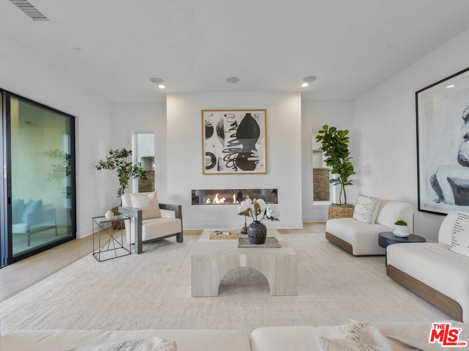 20416 Albion Way Porter Ranch, CA 91326 - Photo 14 of 38 a living room with furniture and a large window