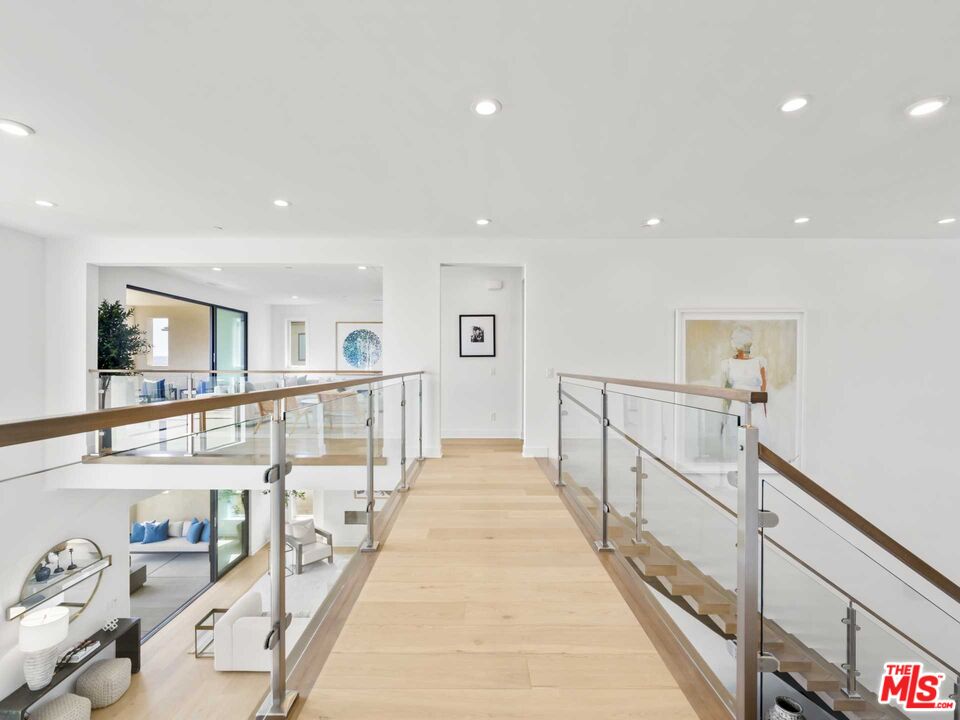 20416 Albion Way Porter Ranch, CA 91326 - Photo 16 of 38 a view of a hallway with furniture and a rug