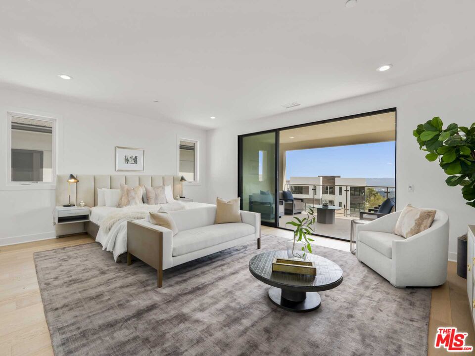 20416 Albion Way Porter Ranch, CA 91326 - Photo 17 of 38 a living room with furniture and a large window