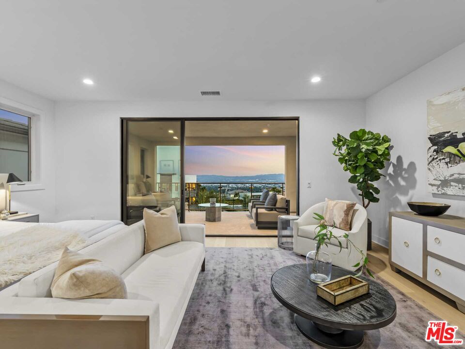 20416 Albion Way Porter Ranch, CA 91326 - Photo 18 of 38 a living room with furniture and a large window