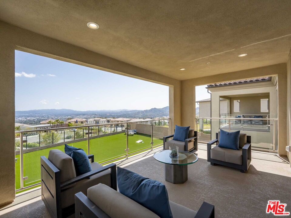 20416 Albion Way Porter Ranch, CA 91326 - Photo 19 of 38 a living room with furniture and a large window