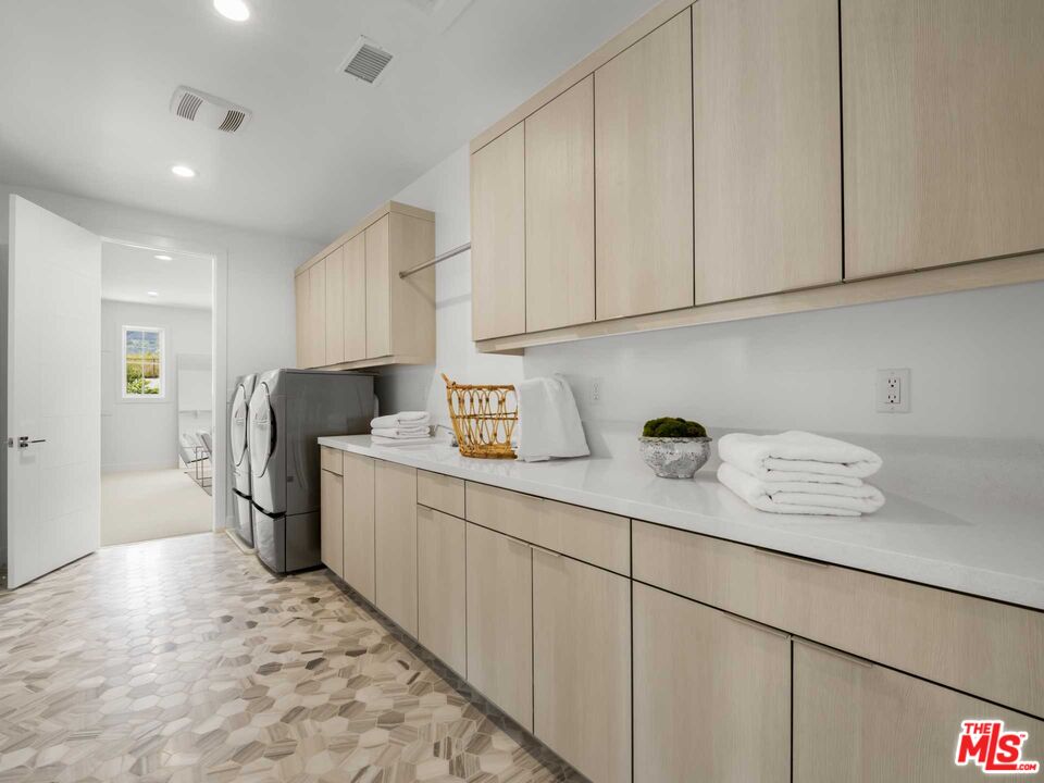 20416 Albion Way Porter Ranch, CA 91326 - Photo 23 of 38 a kitchen with refrigerator and cabinets
