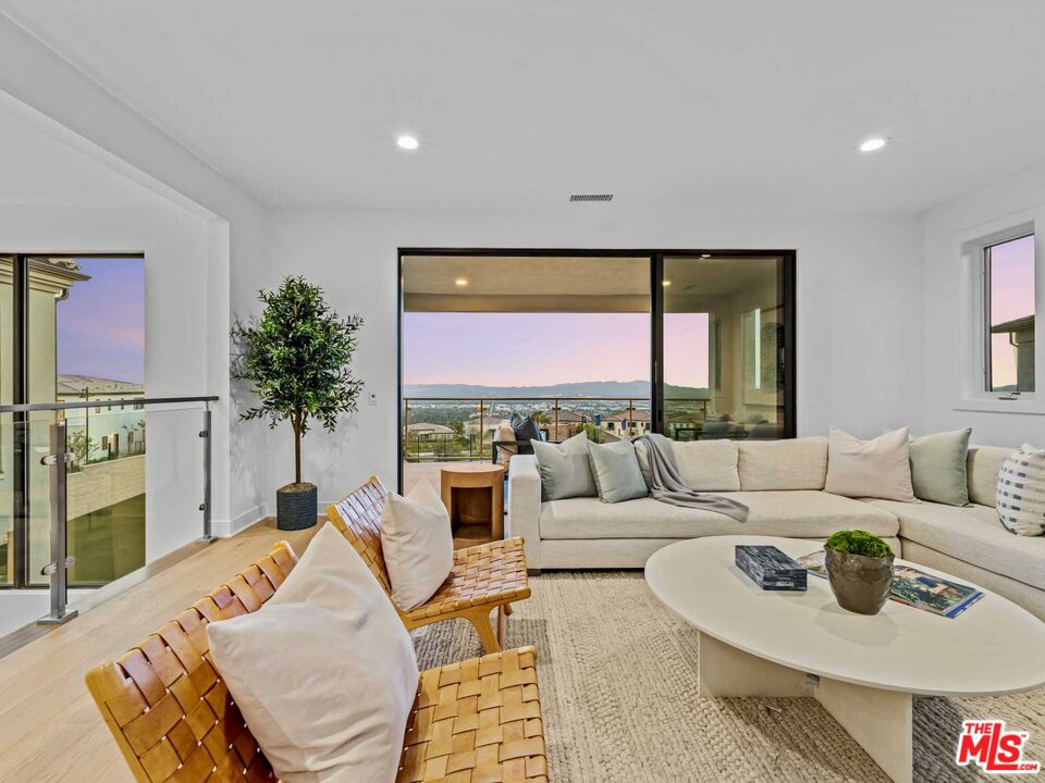 20416 Albion Way Porter Ranch, CA 91326 - Photo 26 of 38 a living room with furniture and a large window