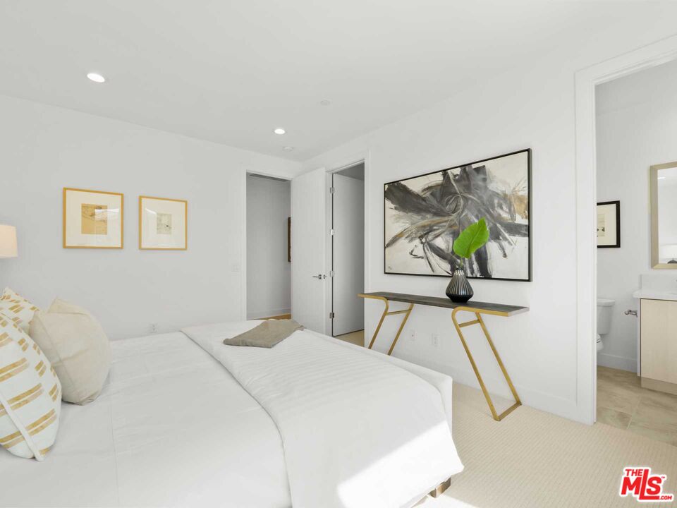 20416 Albion Way Porter Ranch, CA 91326 - Photo 33 of 38 a bedroom with a bed and painting on the wall