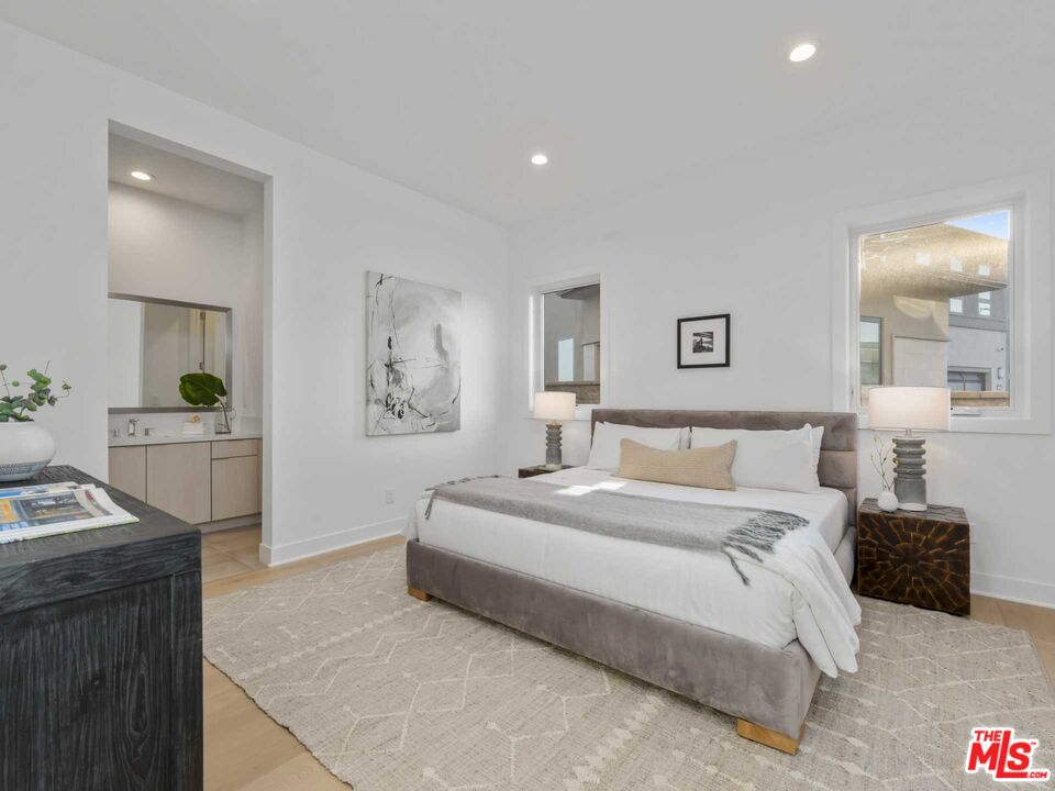 20416 Albion Way Porter Ranch, CA 91326 - Photo 35 of 38 a bedroom with a bed and a couch