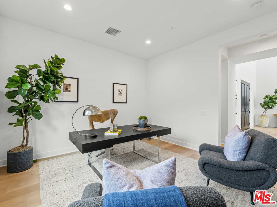 20416 Albion Way Porter Ranch, CA 91326 - Photo 36 of 38 a living room with furniture and a potted plant