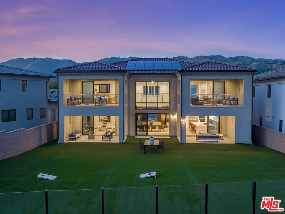 20416 Albion Way Porter Ranch, CA 91326 - Photo 38 of 38 a front view of a house with a yard