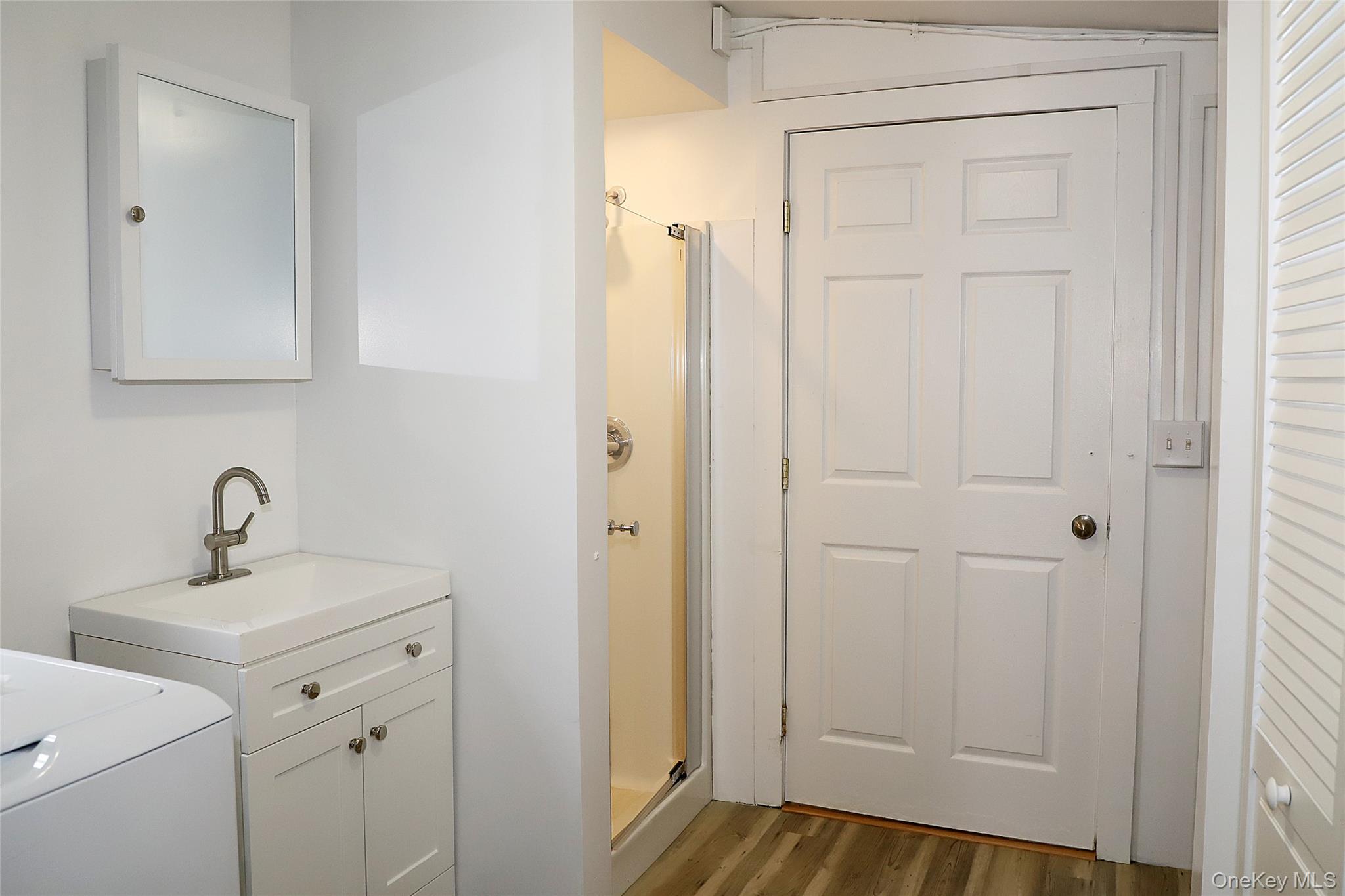 7217 Albany Post Road Red Hook, NY 12572 - Photo 6 of 9 a bathroom with a sink and mirror