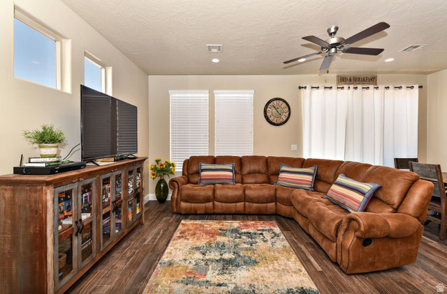 1622 Canyon Tree Drive St. George, UT 84770 - Photo 4 of 34 Spacious living area featuring wood-finish flooring, a ceiling fan with integrated lighting, and recessed ceiling lights