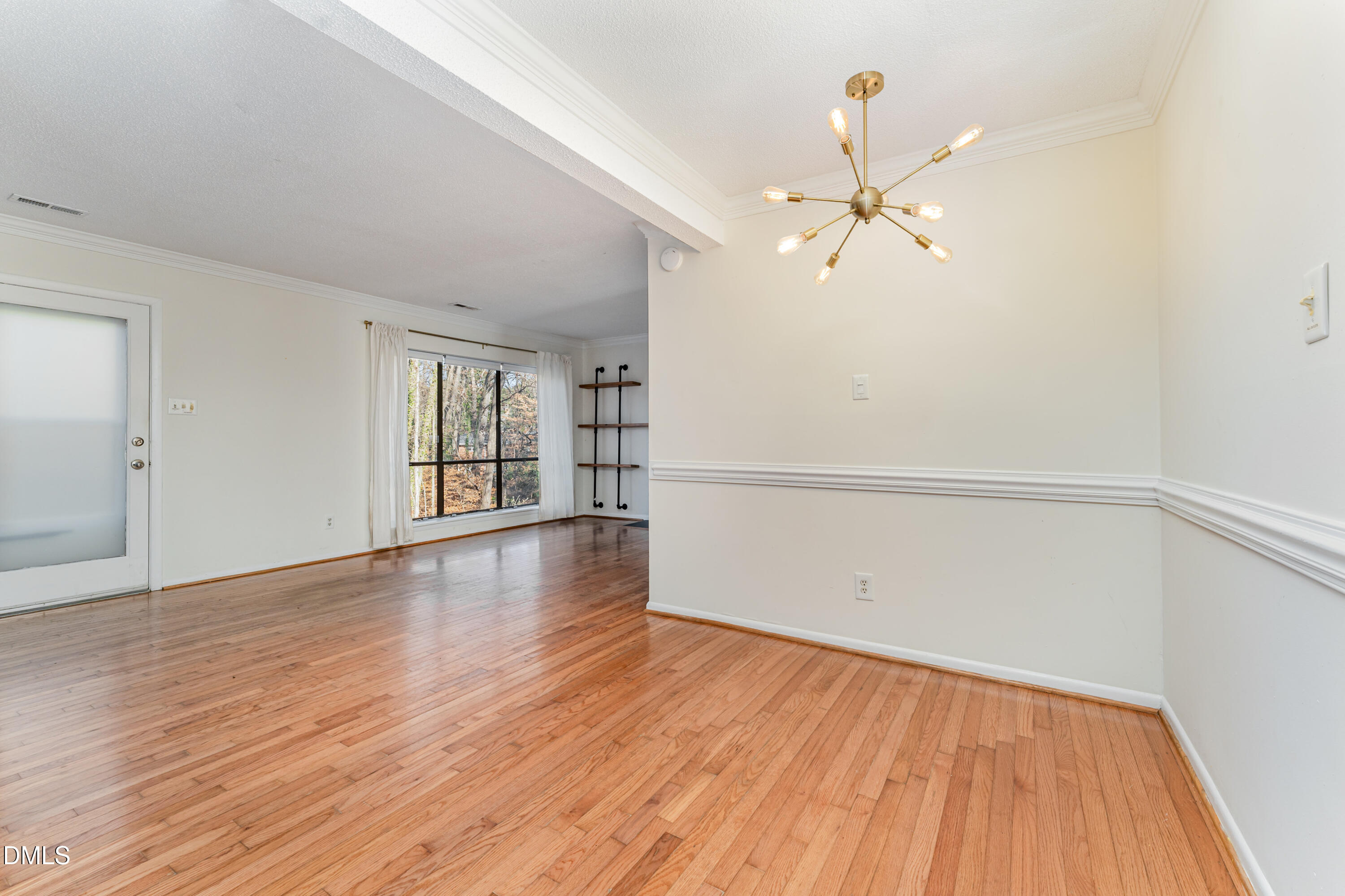 5073 Tall Pines Court Raleigh, NC 27609 - Photo 10 of 32 wooden floor in an empty room with a window