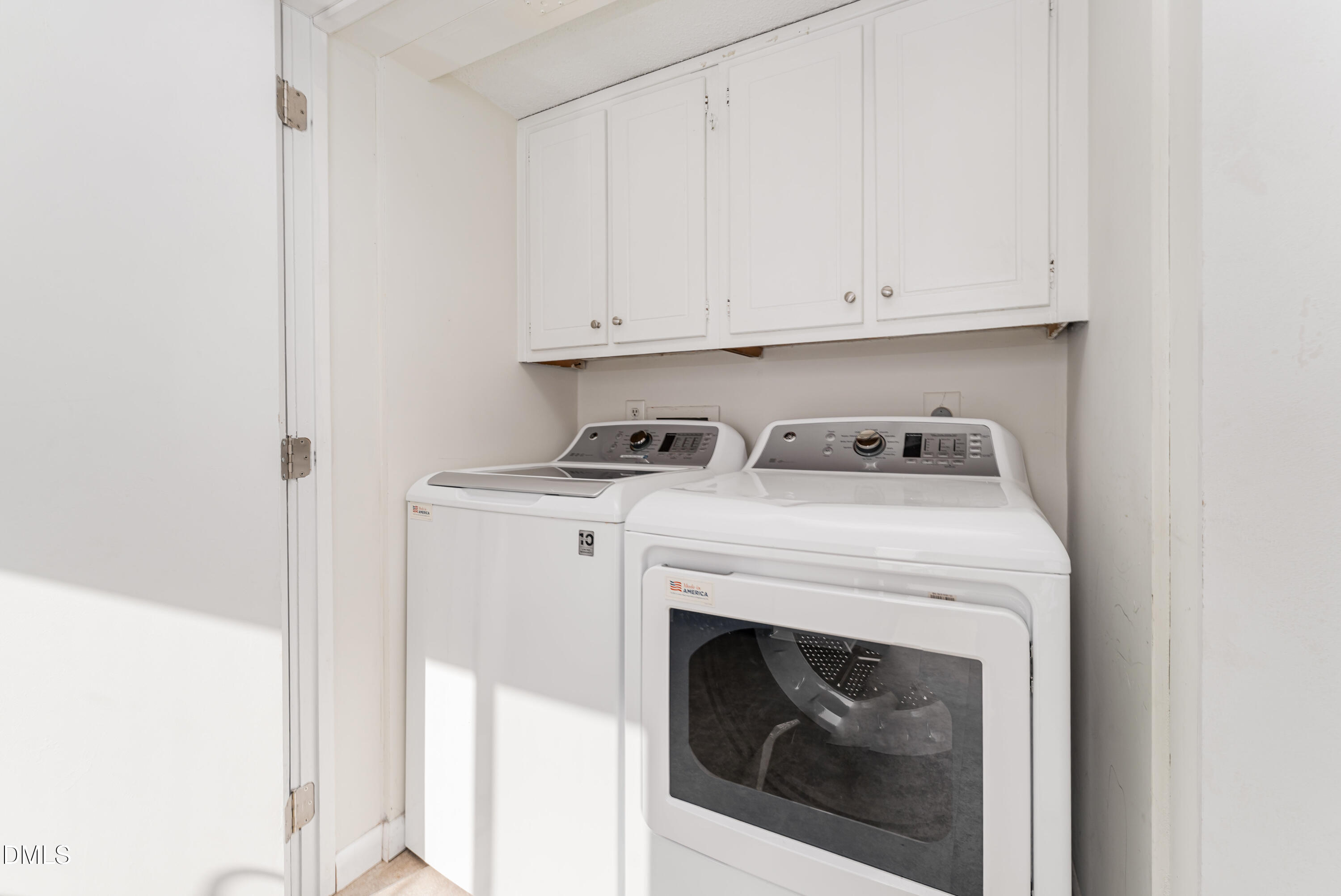5073 Tall Pines Court Raleigh, NC 27609 - Photo 14 of 32 a utility room with dryer and washer