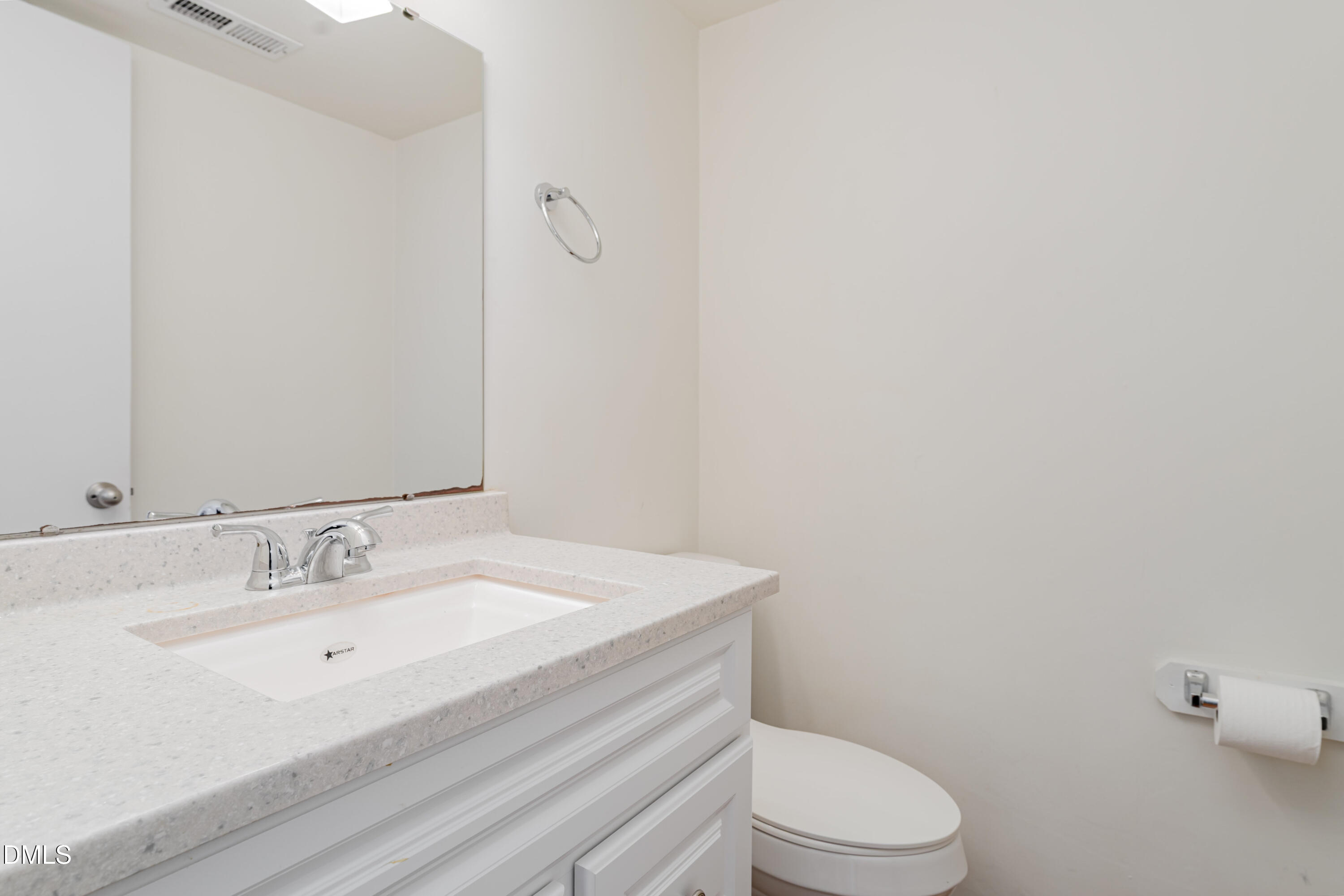 5073 Tall Pines Court Raleigh, NC 27609 - Photo 15 of 32 a bathroom with a sink a toilet and mirror