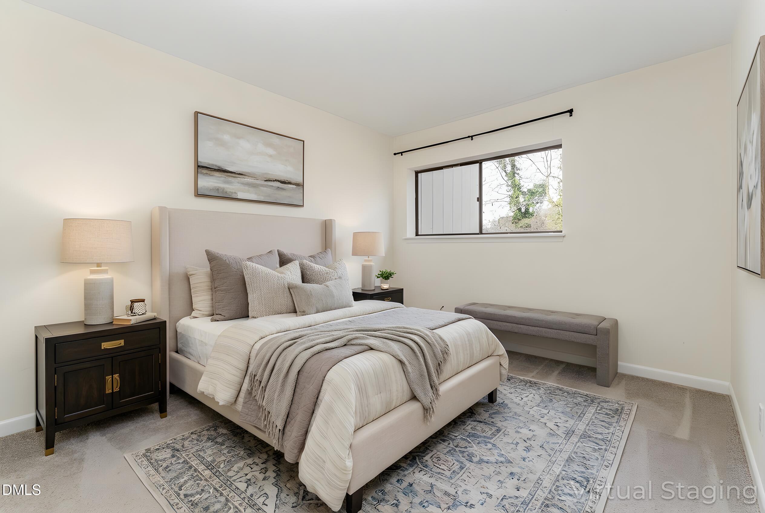 5073 Tall Pines Court Raleigh, NC 27609 - Photo 16 of 32 a bedroom with a bed lamp and wall painting