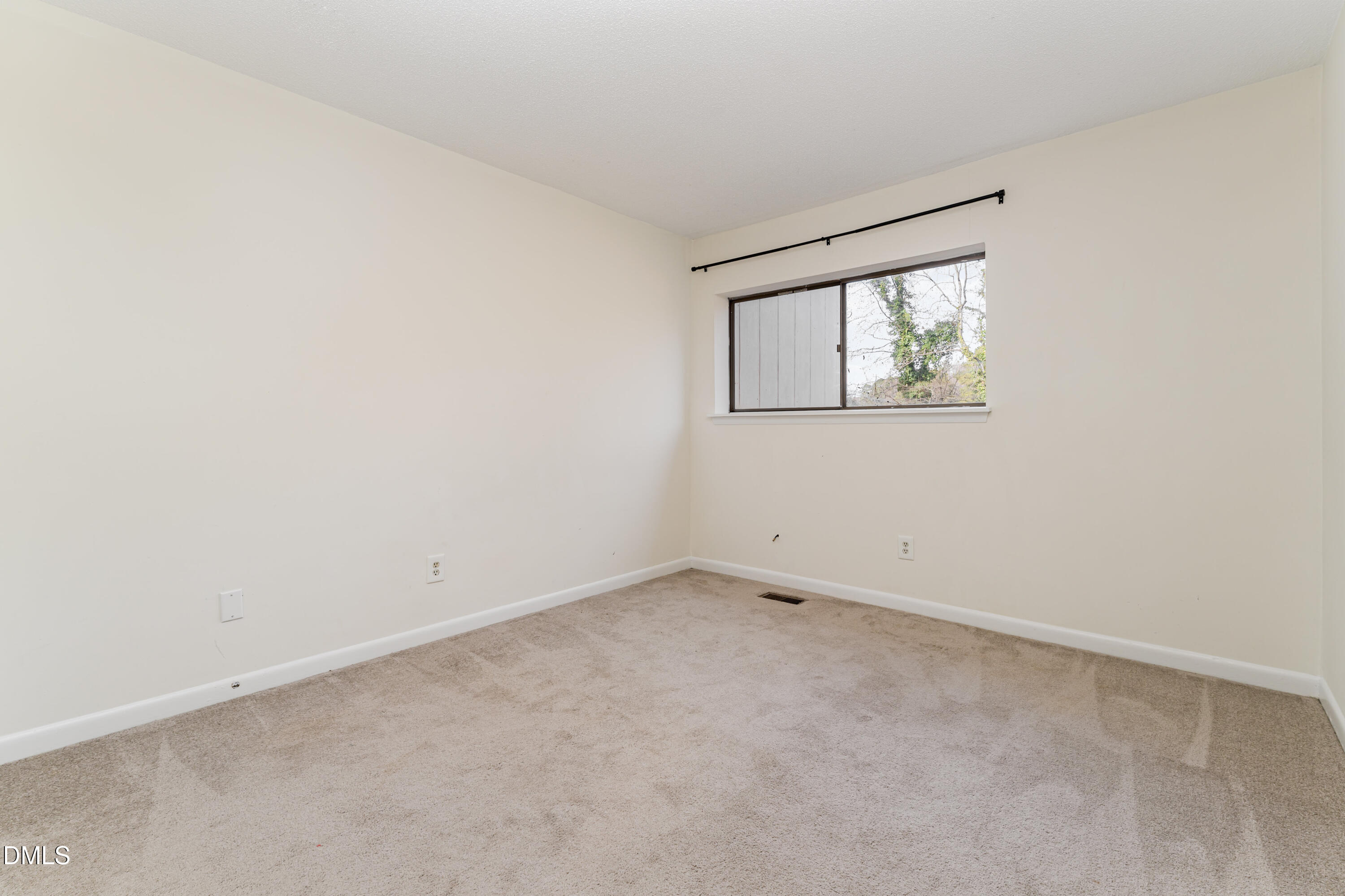 5073 Tall Pines Court Raleigh, NC 27609 - Photo 17 of 32 an empty room with a window