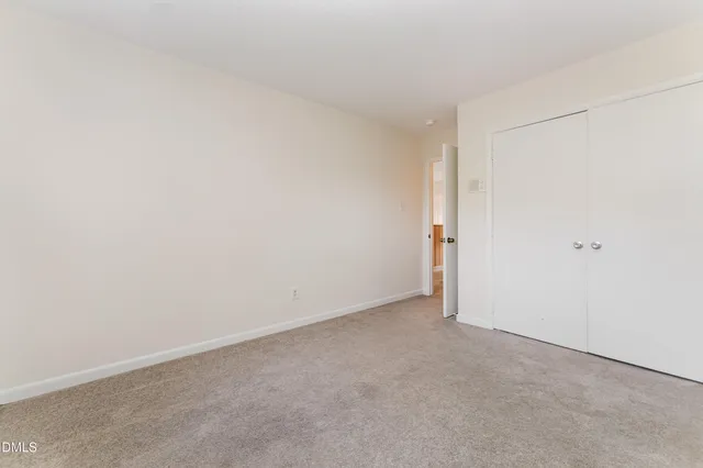 an empty room with a view of a bathroom