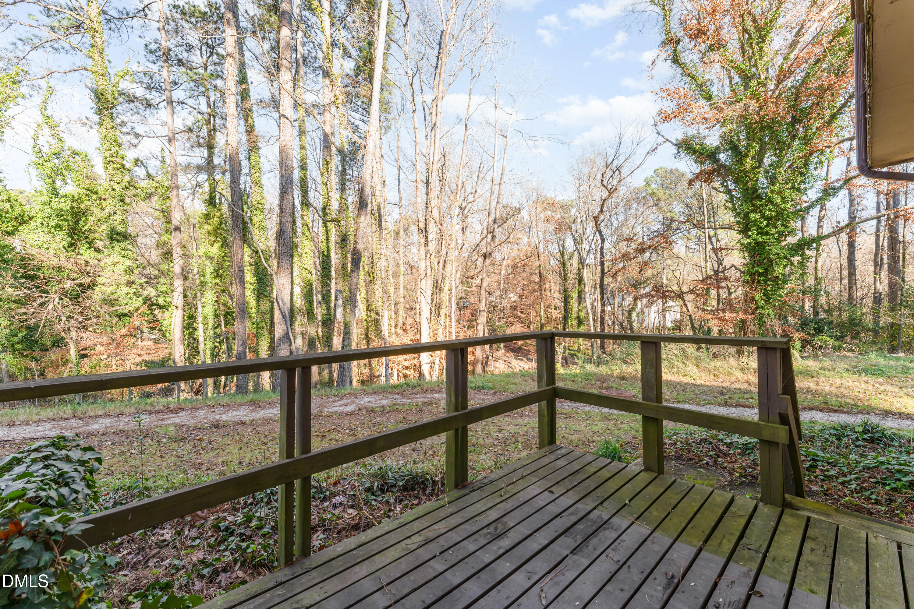5073 Tall Pines Court Raleigh, NC 27609 - Photo 27 of 32 a view of balcony with wooden floor and fence