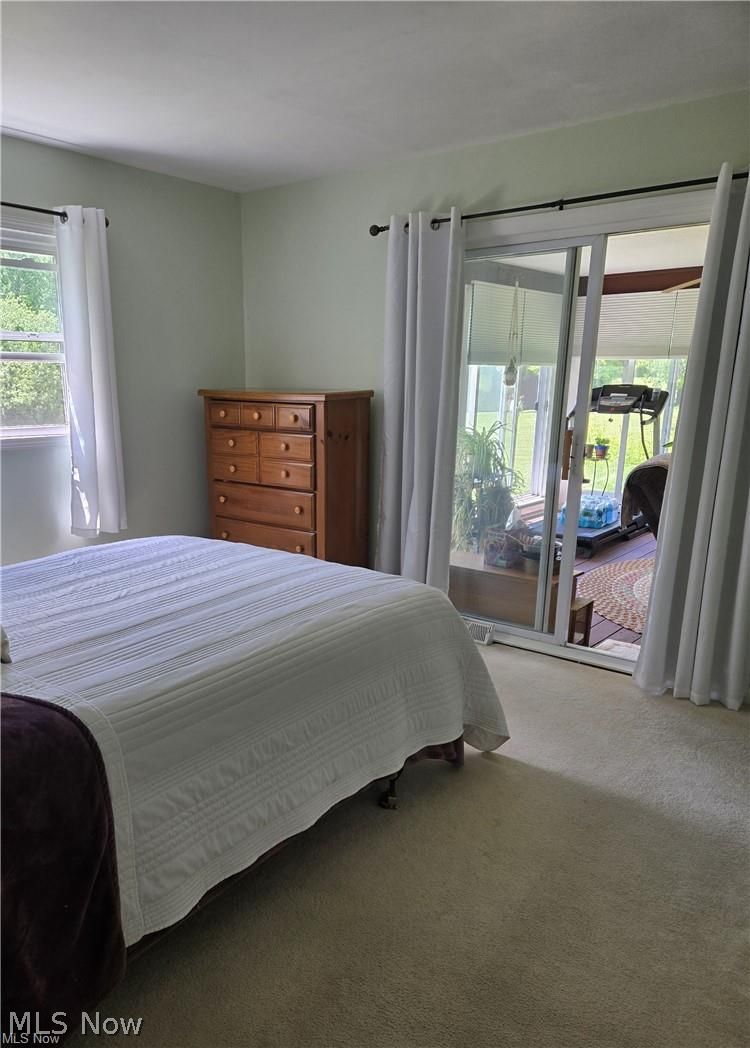 14640 Stone Road Newbury, OH 44065 - Photo 16 of 19 The master bedroom has a sliding door to the sun room