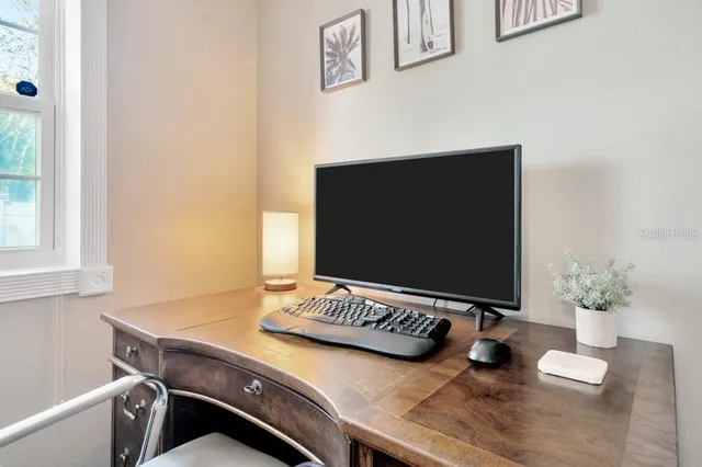 a room with a window and chair