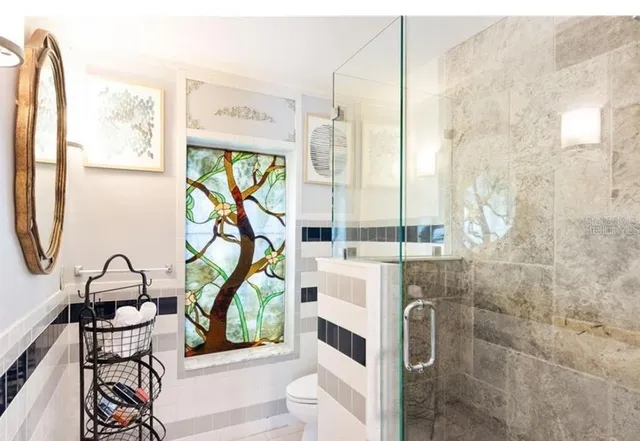 a patio with a table and chairs under an umbrella