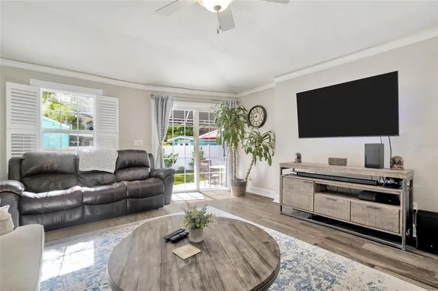 a view of a house with backyard sitting area and garden