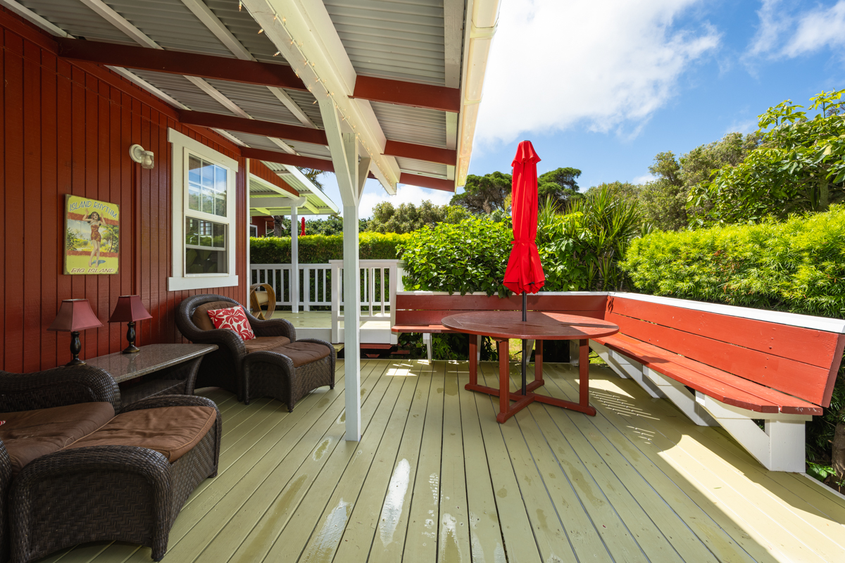 66-1685 Kohala Mountain Road Kamuela, HI 96743 - Photo 22 of 26 a outdoor space with the couches and dining table with wooden floor
