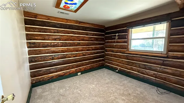 a front view of a house with a yard and a garage