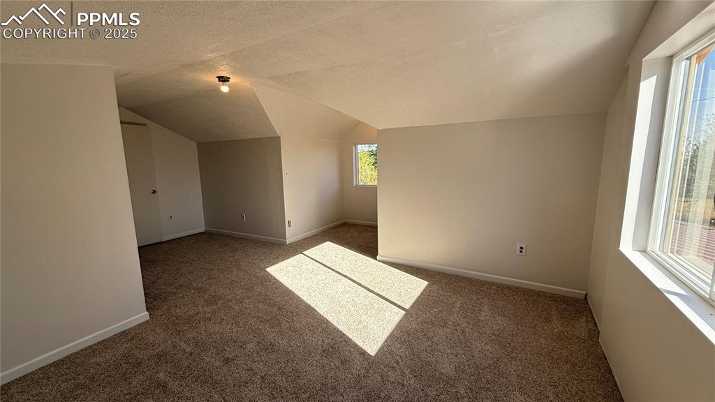 3250 Slocum Road Peyton, CO 80831 - Photo 25 of 50 an empty room with windows