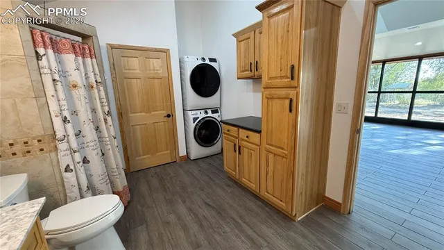 an aerial view of a house with garden space and street view