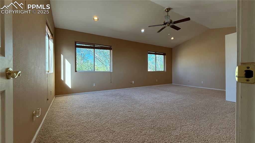 3250 Slocum Road Peyton, CO 80831 - Photo 30 of 50 a view of a livingroom with a ceiling fan and window