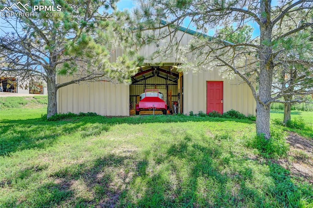 3250 Slocum Road Peyton, CO 80831 - Photo 40 of 50 a front view of house with yard and tree in it