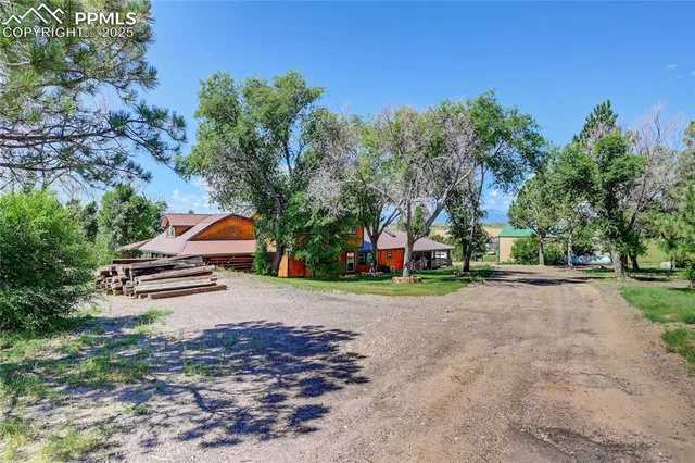 a view of livingroom with hallway and wooden floor