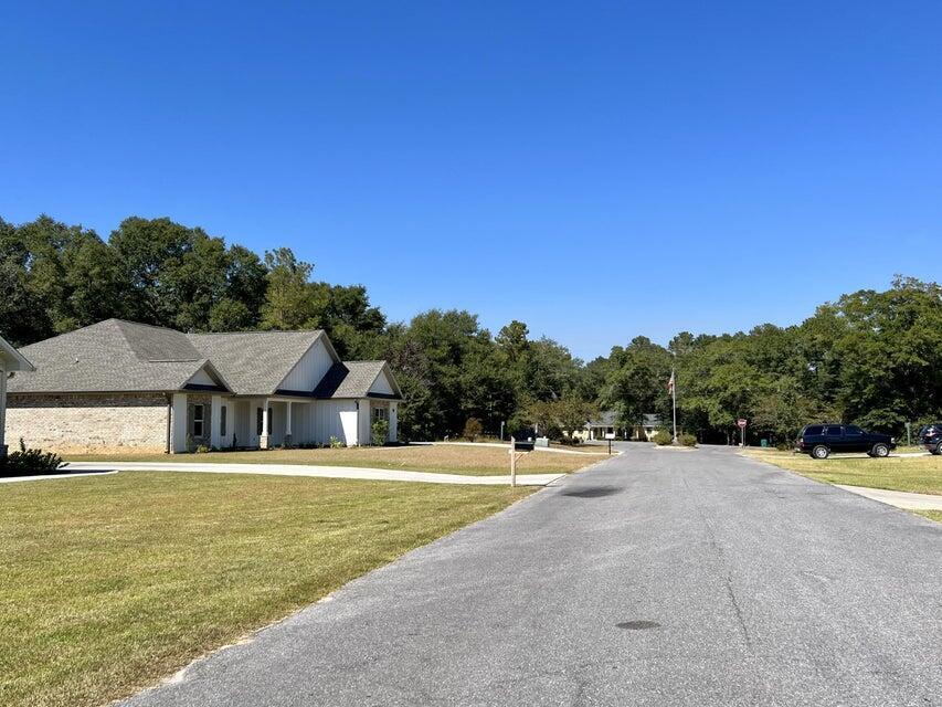 Lot D-5 Wayne Rogers Road Crestview, FL 32539 - Photo 5 of 6 a front view of a house with a yard