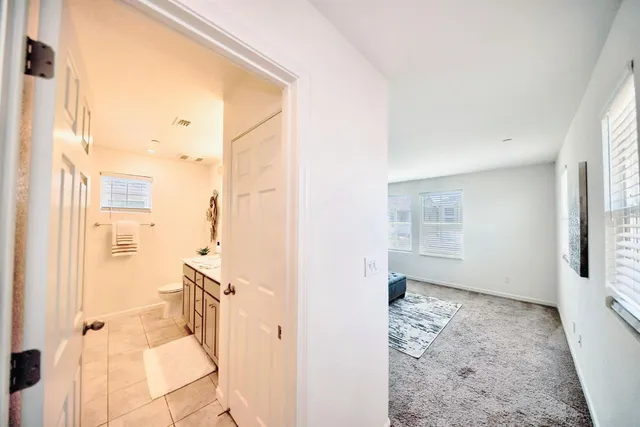 a bathroom with a shower and a glass door
