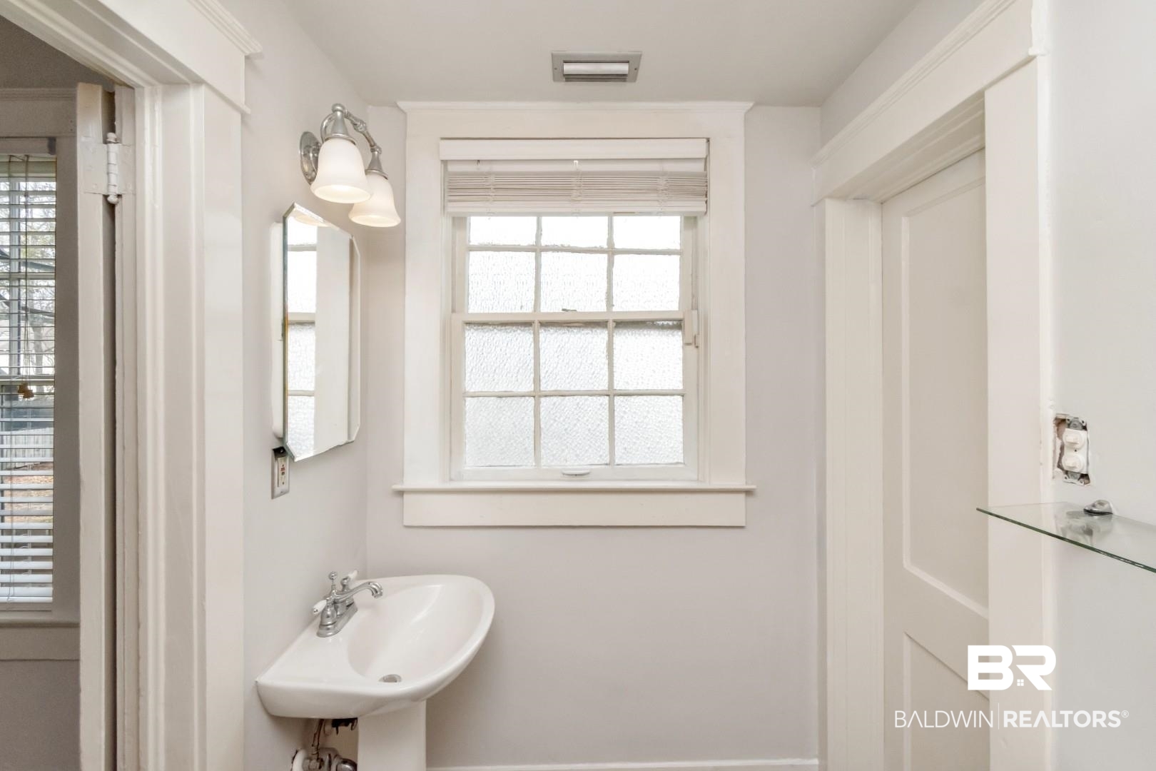 1602 Government Street, Unit 1A Mobile, AL 36604 - Photo 16 of 24 Half bath with plenty of natural light