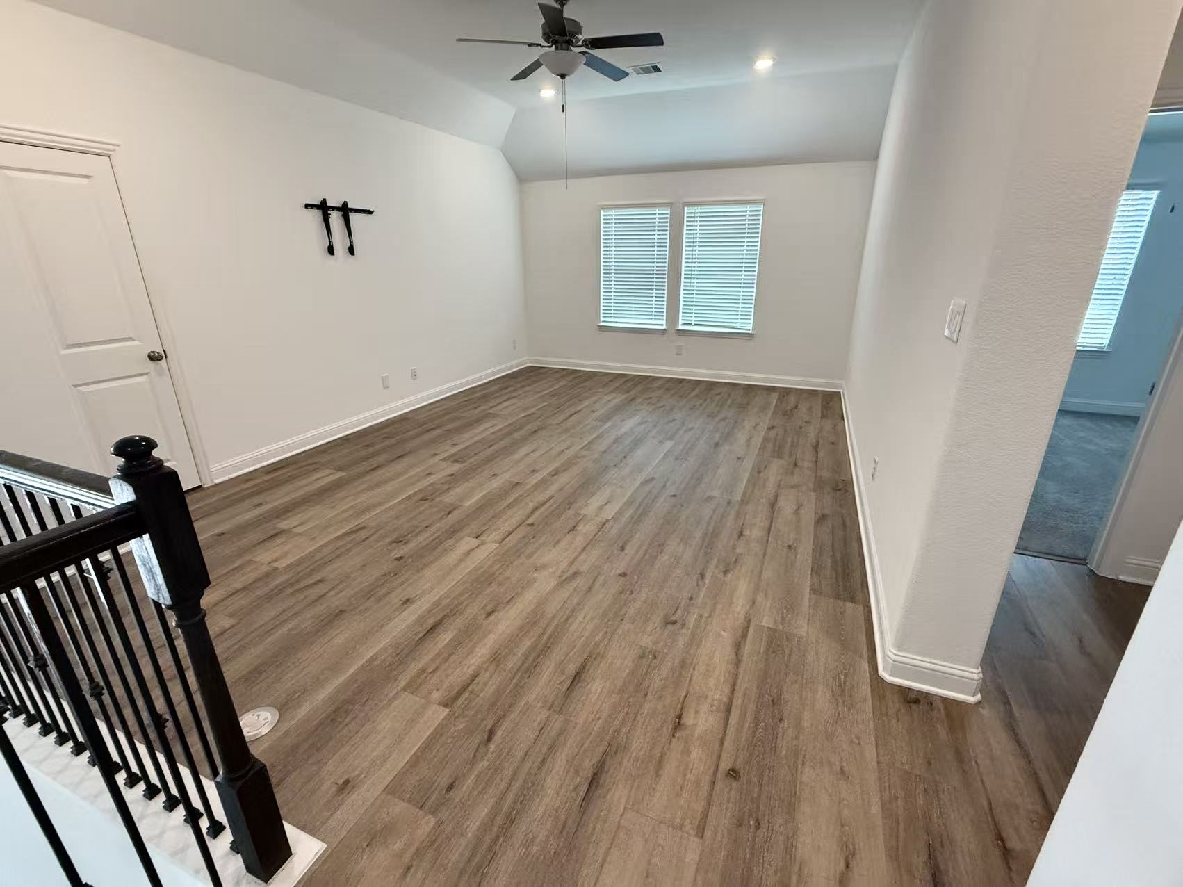 29806 Cherry Vine Road Katy, TX 77494 - Photo 18 of 30 wooden floor in an empty room with a window