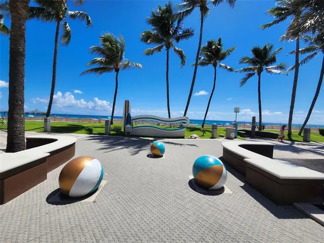 a view of a swimming pool with lounge chairs