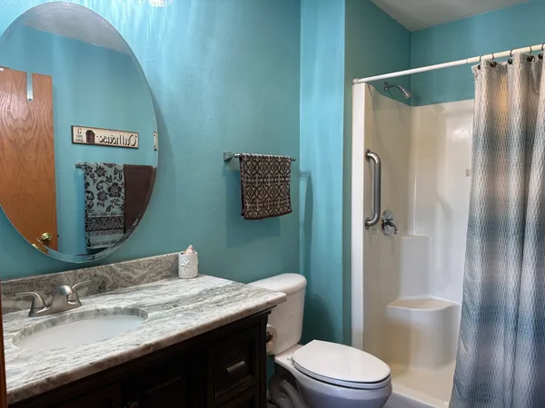a kitchen with a refrigerator and a sink