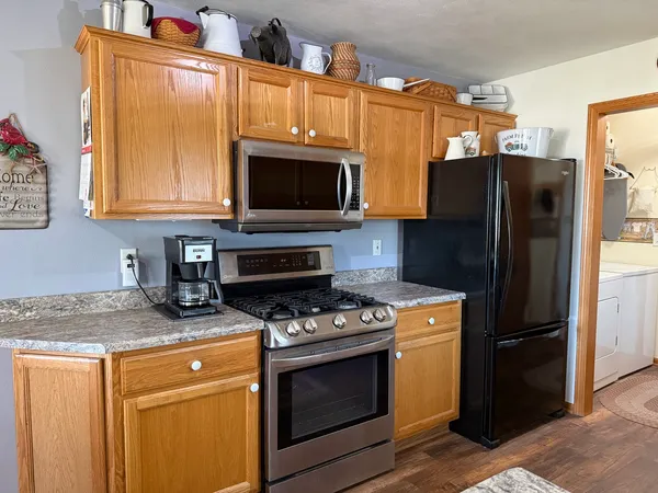 a view of a livingroom with furniture and a flat screen tv