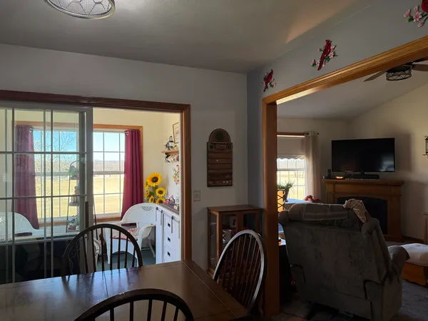 a living room with furniture a couch and a window