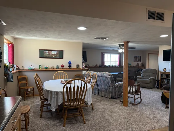 a kitchen with granite countertop a refrigerator stove and oven