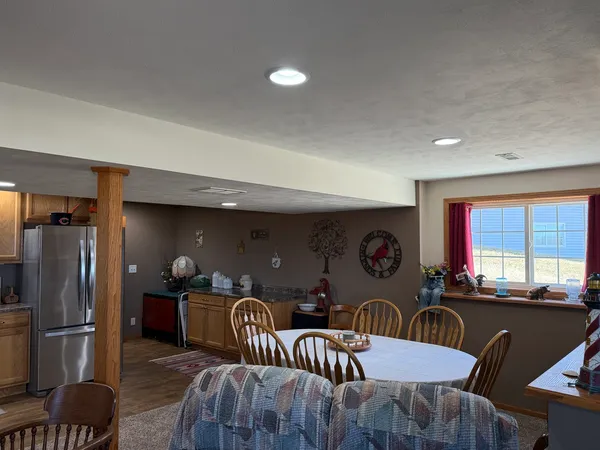 a view of a refrigerator in kitchen and living room