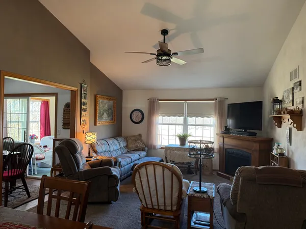 a view of a livingroom with furniture and a table
