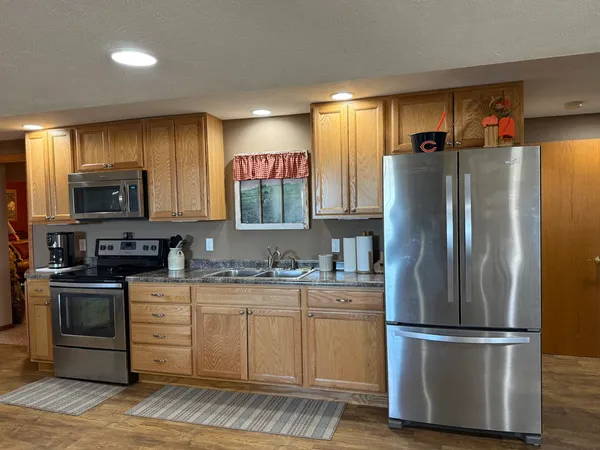 a view of yard with wooden fence