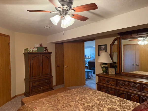 a view of a garage with parked cars