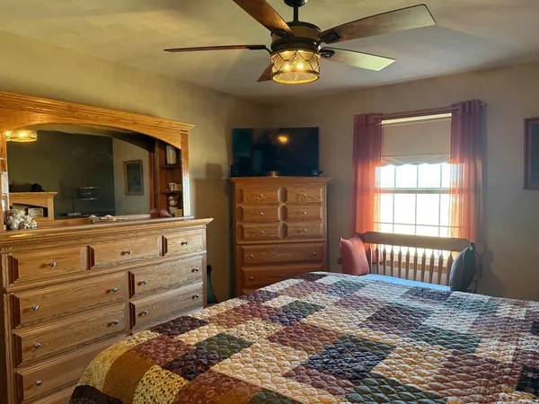 a view of a hallway with bathroom and small closet