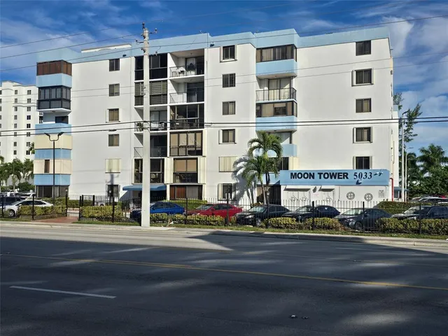 a tall building sitting on the side of a street