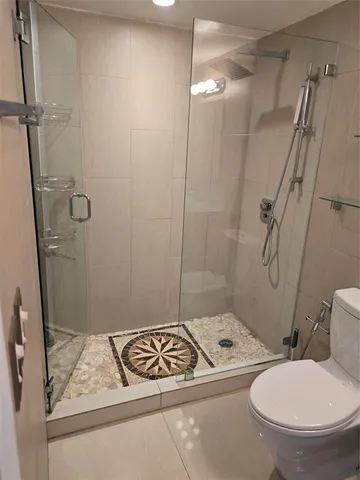 an empty room with wooden floor and closet